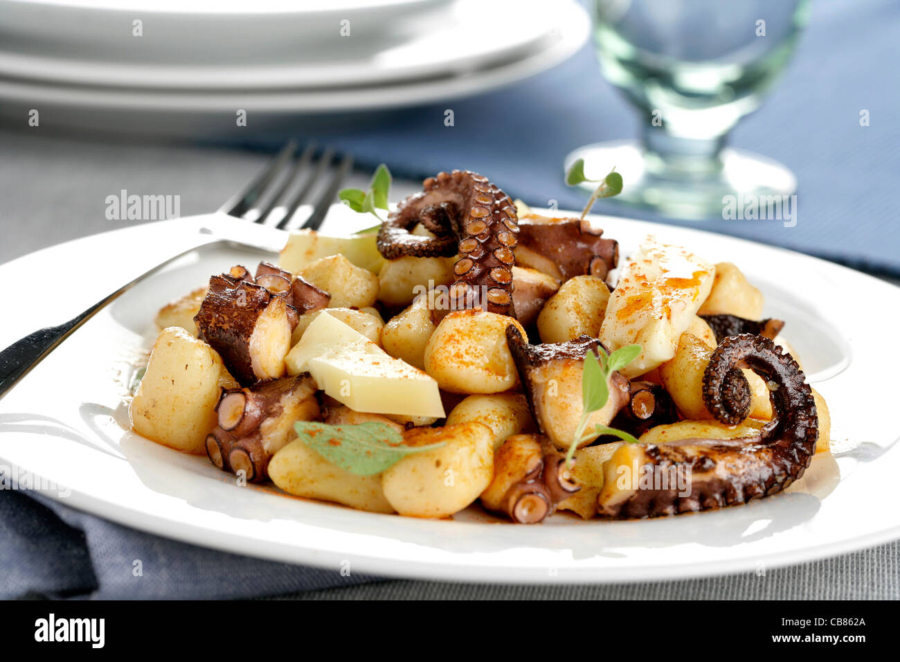Gnocchi with octopus, cheese and paprika oil Stock Photo Alamy