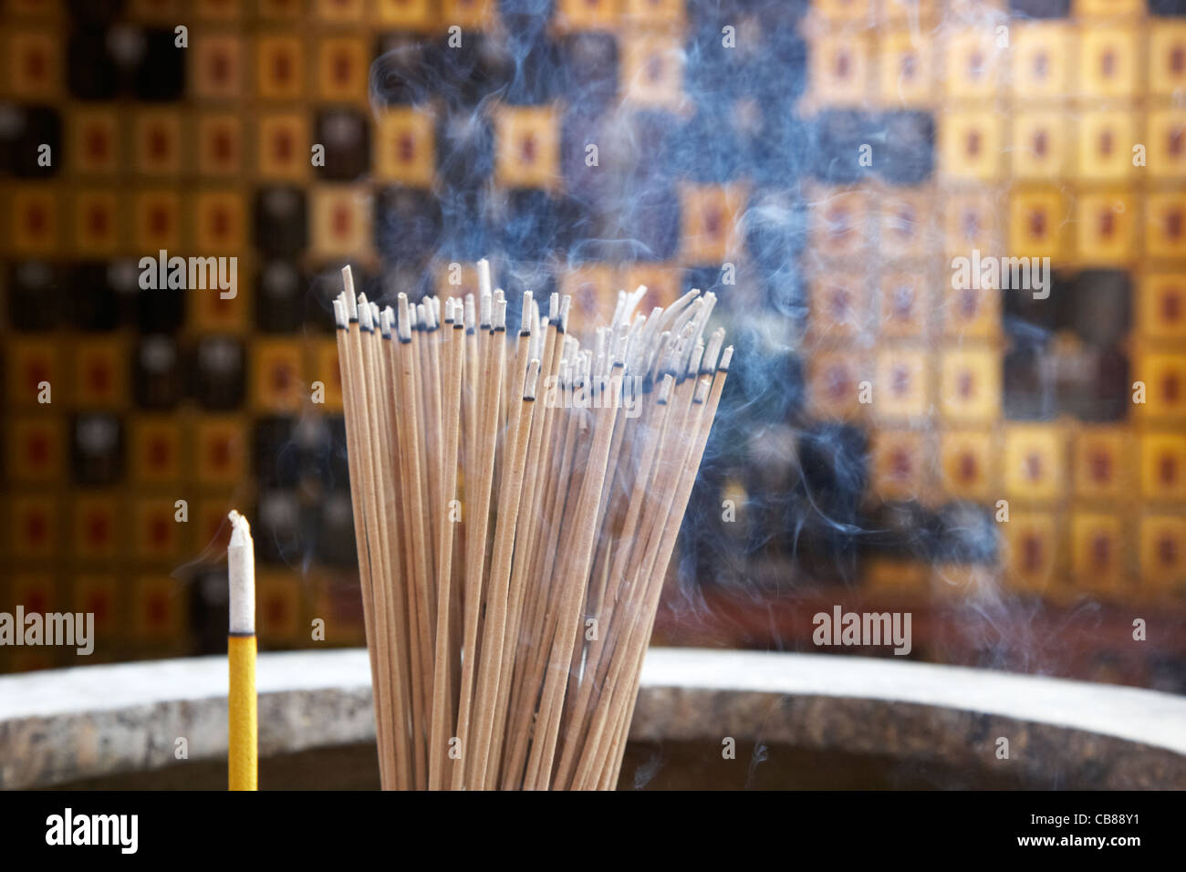 burning incense in a columbarium of po fook hill cemetery sha tin, hong kong, hksar, china Stock Photo