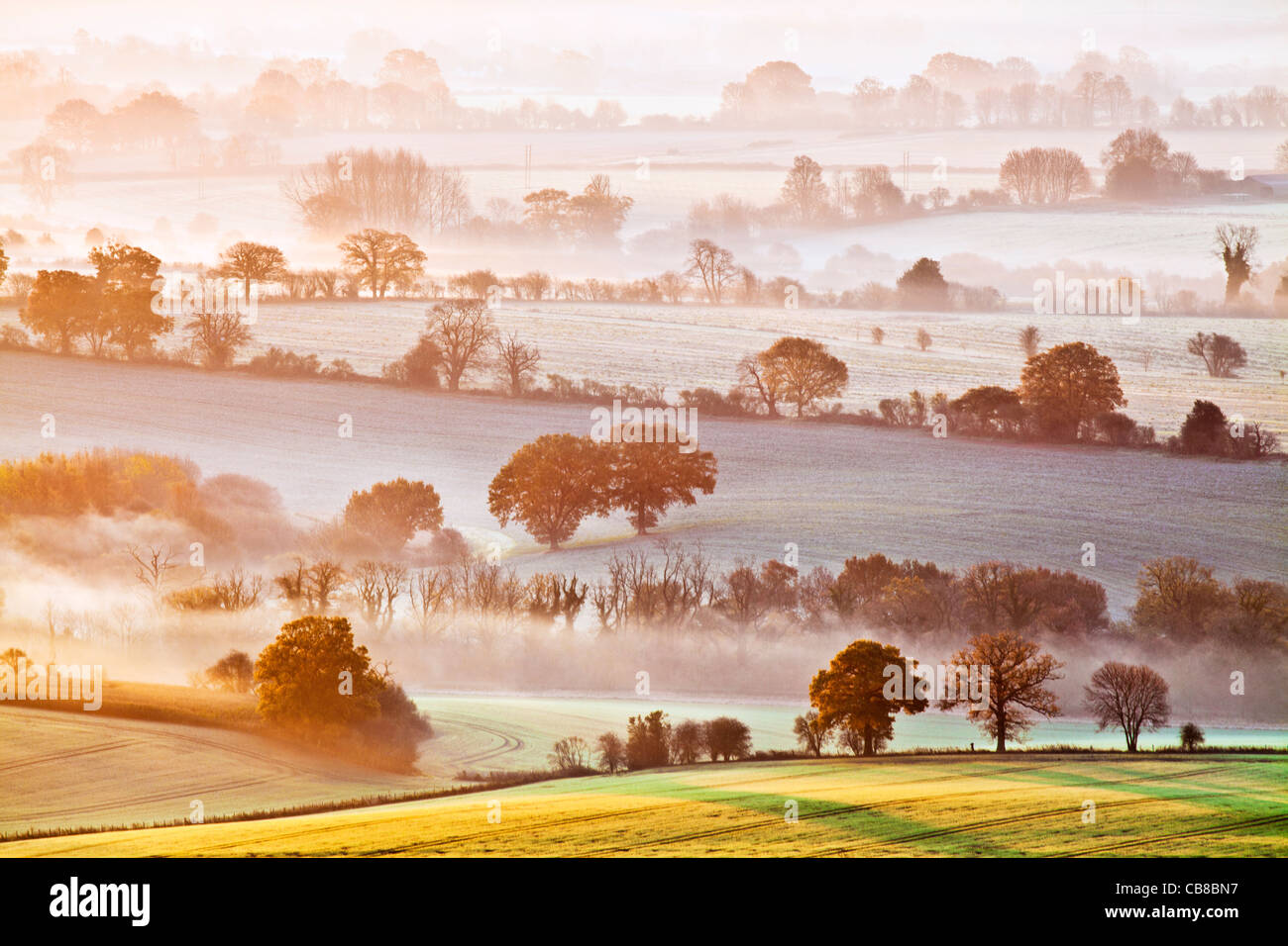 A winter sunrise view from Martinsell Hill over the Vale of Pewsey in Wiltshire, England, UK Stock Photo