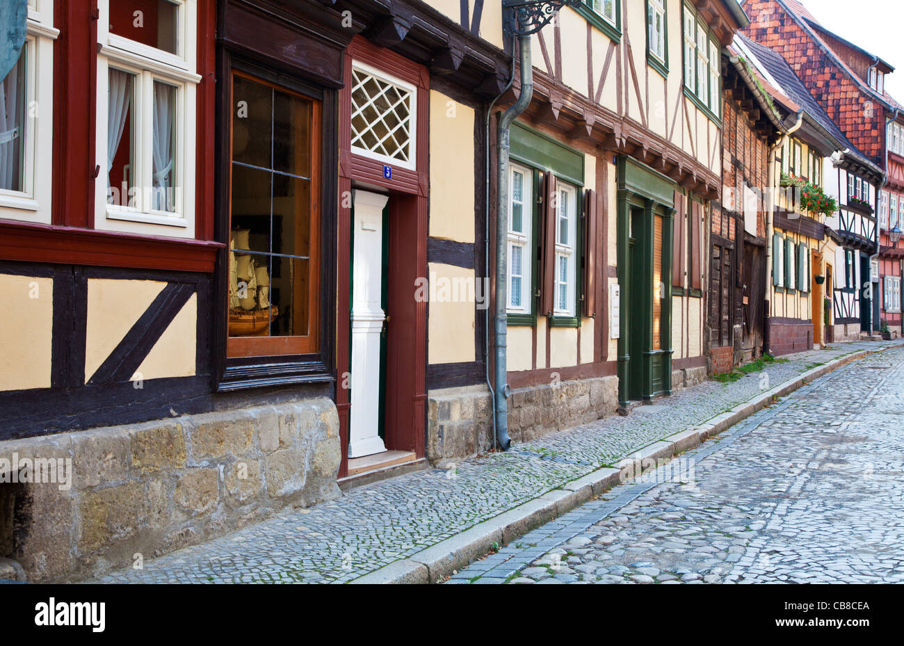 A row of half-timbered medieval houses in a cobbled street in the UNESCO World Heritage town of Quedlinburg, Germany. Stock Photo