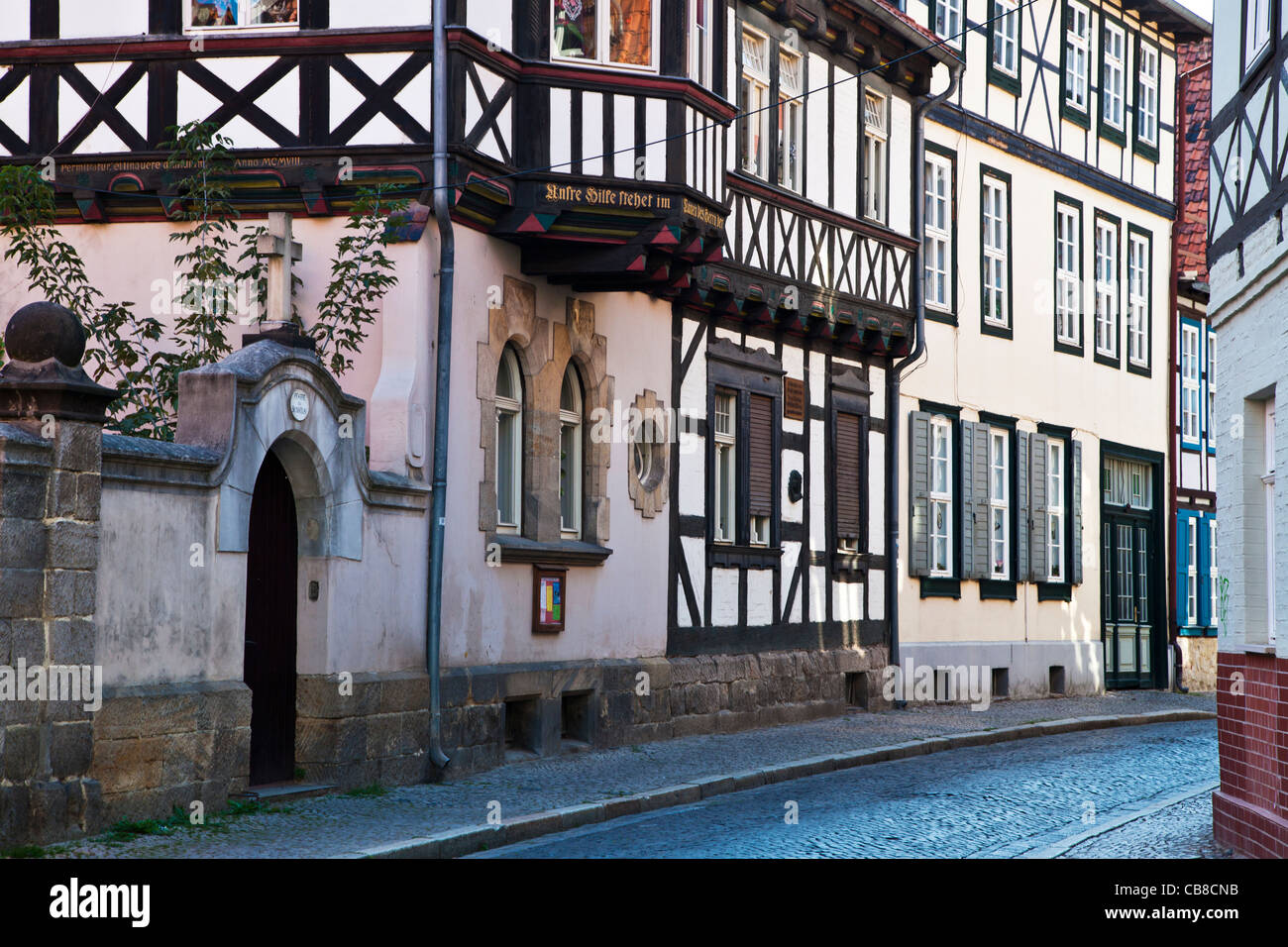 A row of half-timbered medieval houses in a cobbled street in the UNESCO World Heritage town of Quedlinburg, Germany. Stock Photo