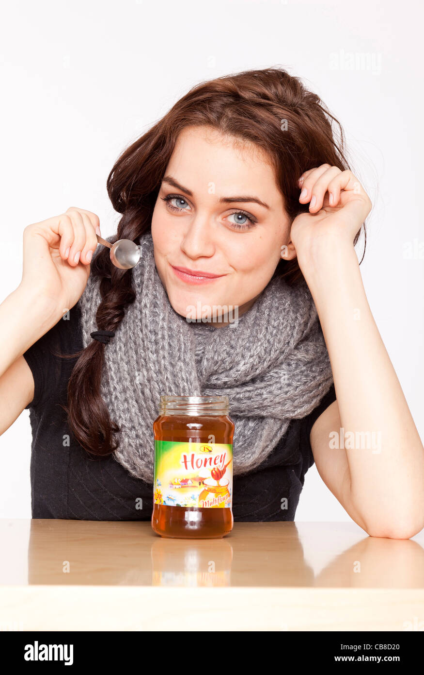 A beautiful young woman, eating honey. (CTK Photo/Rene Fluger Stock Photo Alamy