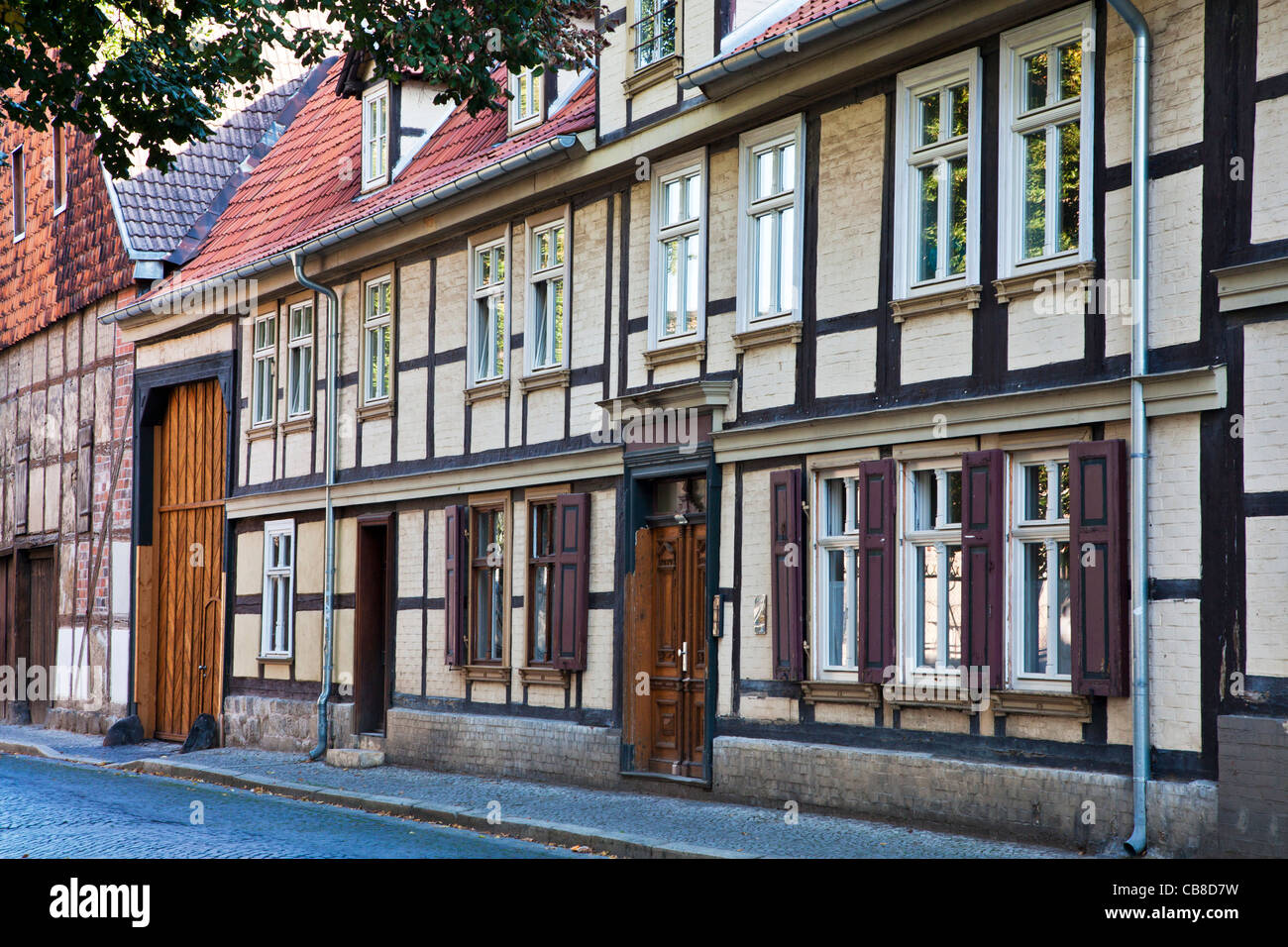 A row of half-timbered medieval houses in a cobbled street in the UNESCO World Heritage town of Quedlinburg, Germany. Stock Photo