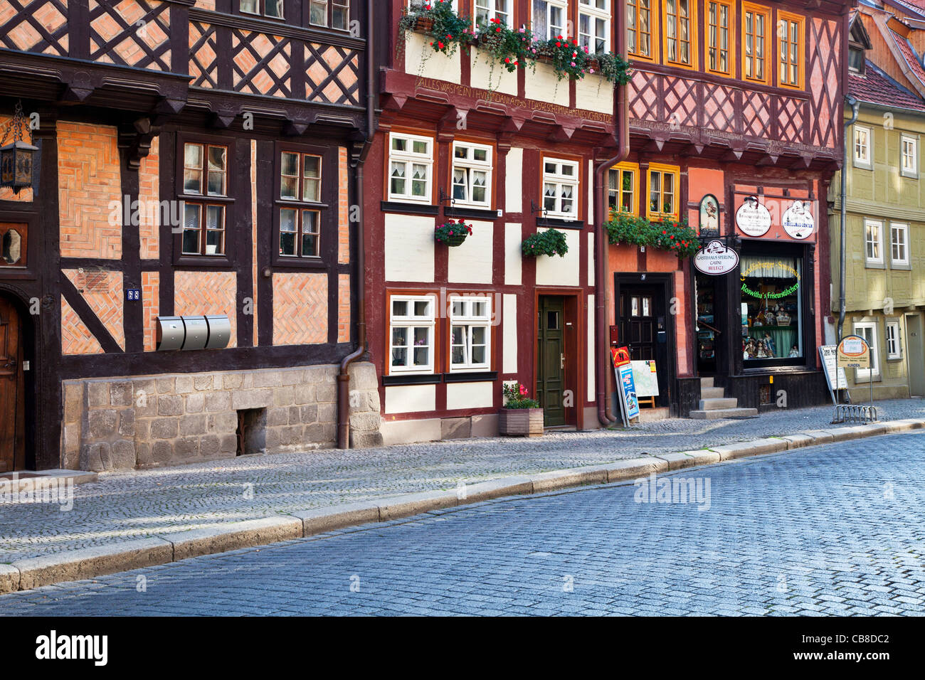 A row of half-timbered medieval houses in a cobbled street in the UNESCO World Heritage town of Quedlinburg, Germany. Stock Photo