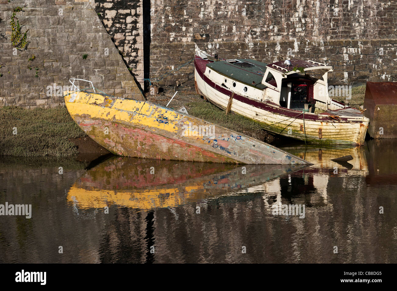 old abandoned boats next to Conwy castle Wales Stock Photo
