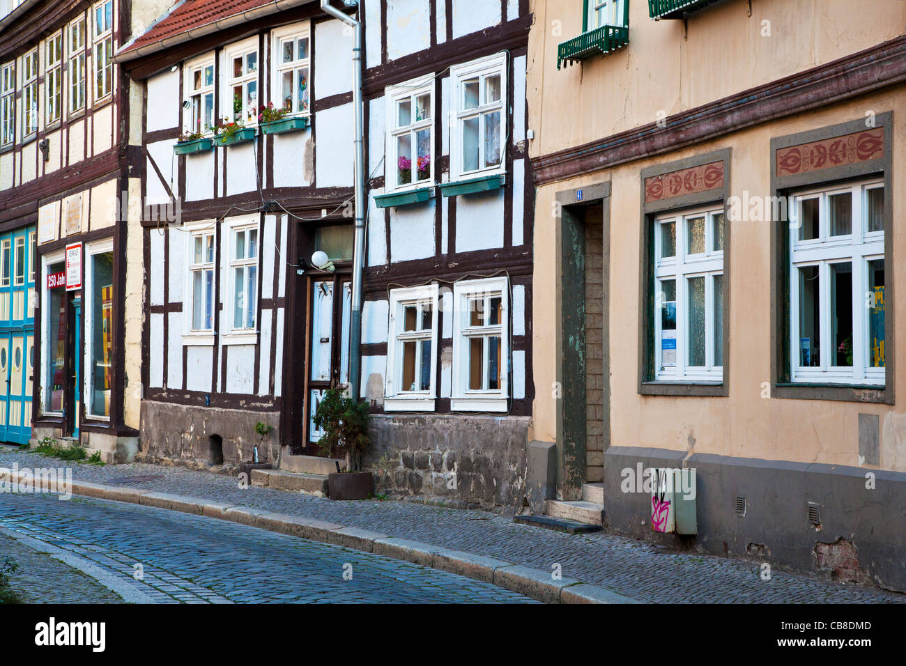 Half-timbered medieval houses in a cobbled street in the UNESCO World Heritage town of Quedlinburg, Germany. Stock Photo