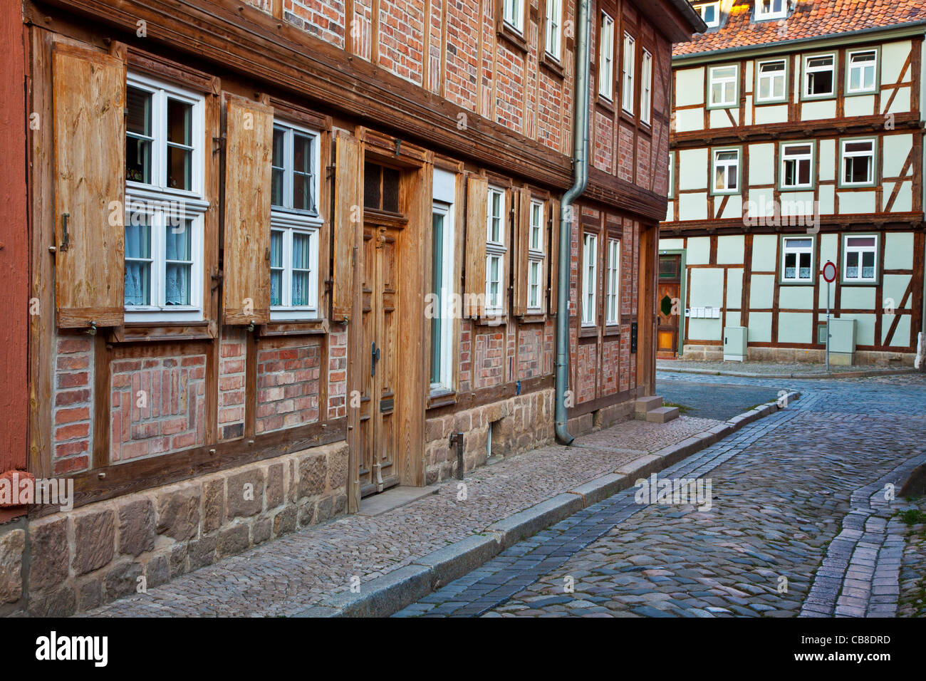 Half-timbered medieval houses in a cobbled street in the UNESCO World Heritage town of Quedlinburg, Germany. Stock Photo