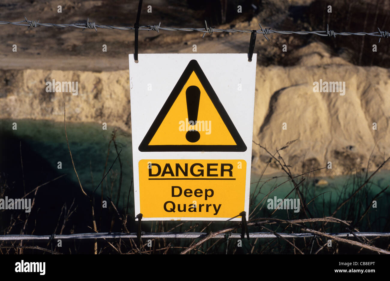 danger deep quarry warning sign at limestone quarry UK Stock Photo Alamy