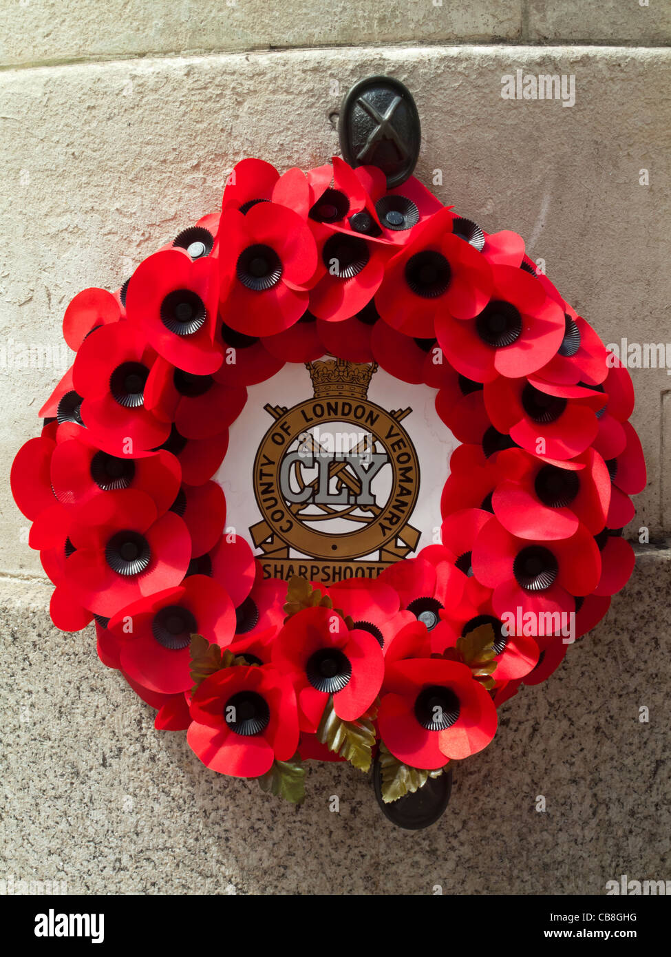 Poppy wreath commemorating the County of London Yeomanry displayed in the City of London England UK Stock Photo