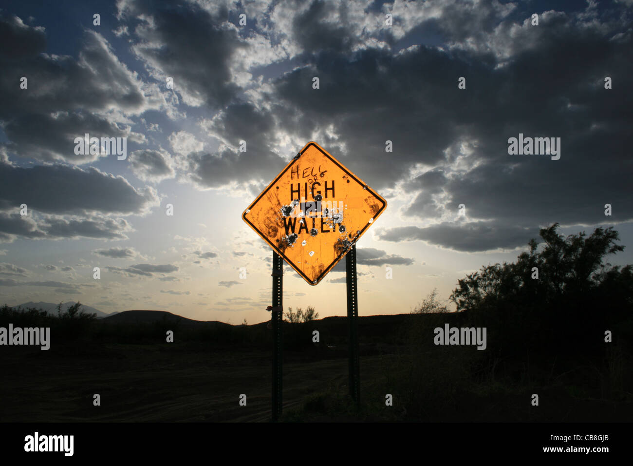 high water road sign shot and altered to read hell or high water Stock Photo