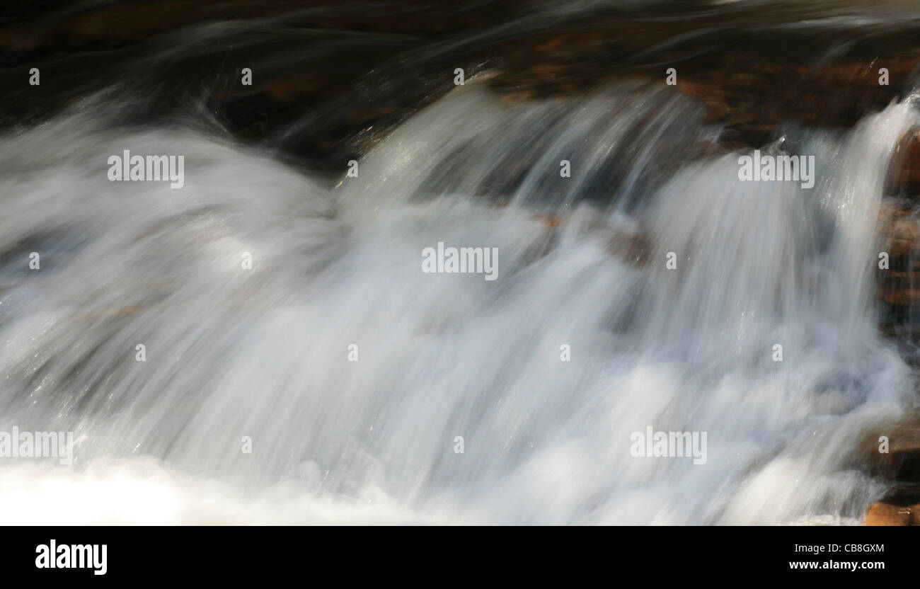 long exposure of rushing water in rapids Stock Photo
