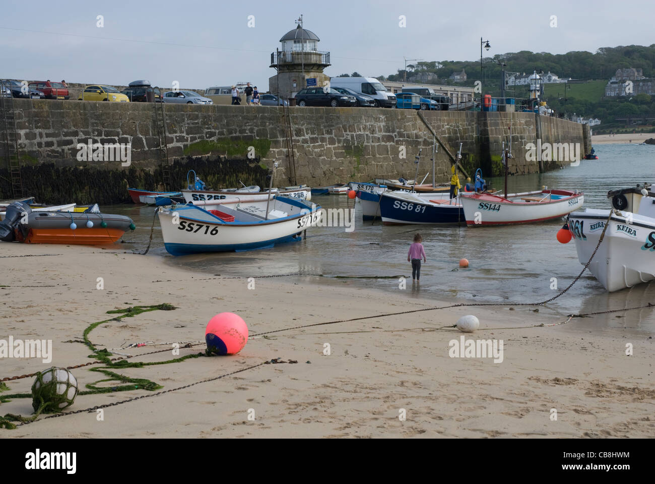 Boats moored on St Ives Harbour Beach at low tide, St Ives, Cornwall England UK Stock Photo
