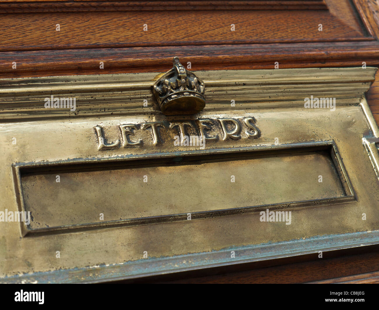 Crown crested official brass letter box on Government building door in central London UK Stock Photo