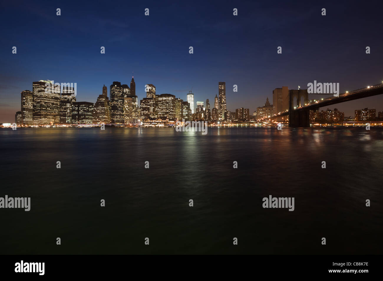 The New York City skyline at twilight w Brooklyn Bridge Stock Photo - Alamy