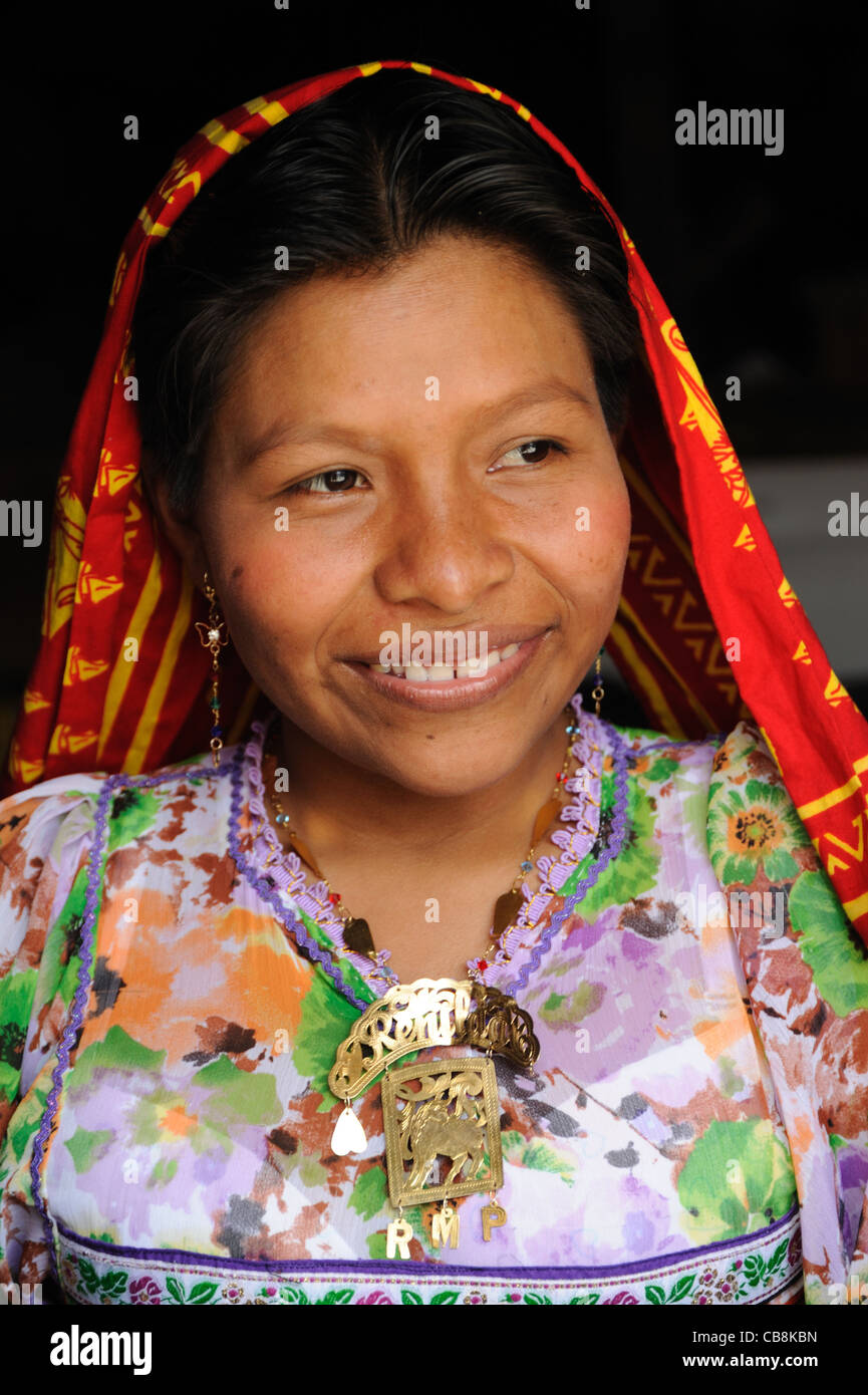 Guna indian woman smiling with typical red bandana at Corbisky island in Guna Yala, Panama. Stock Photo
