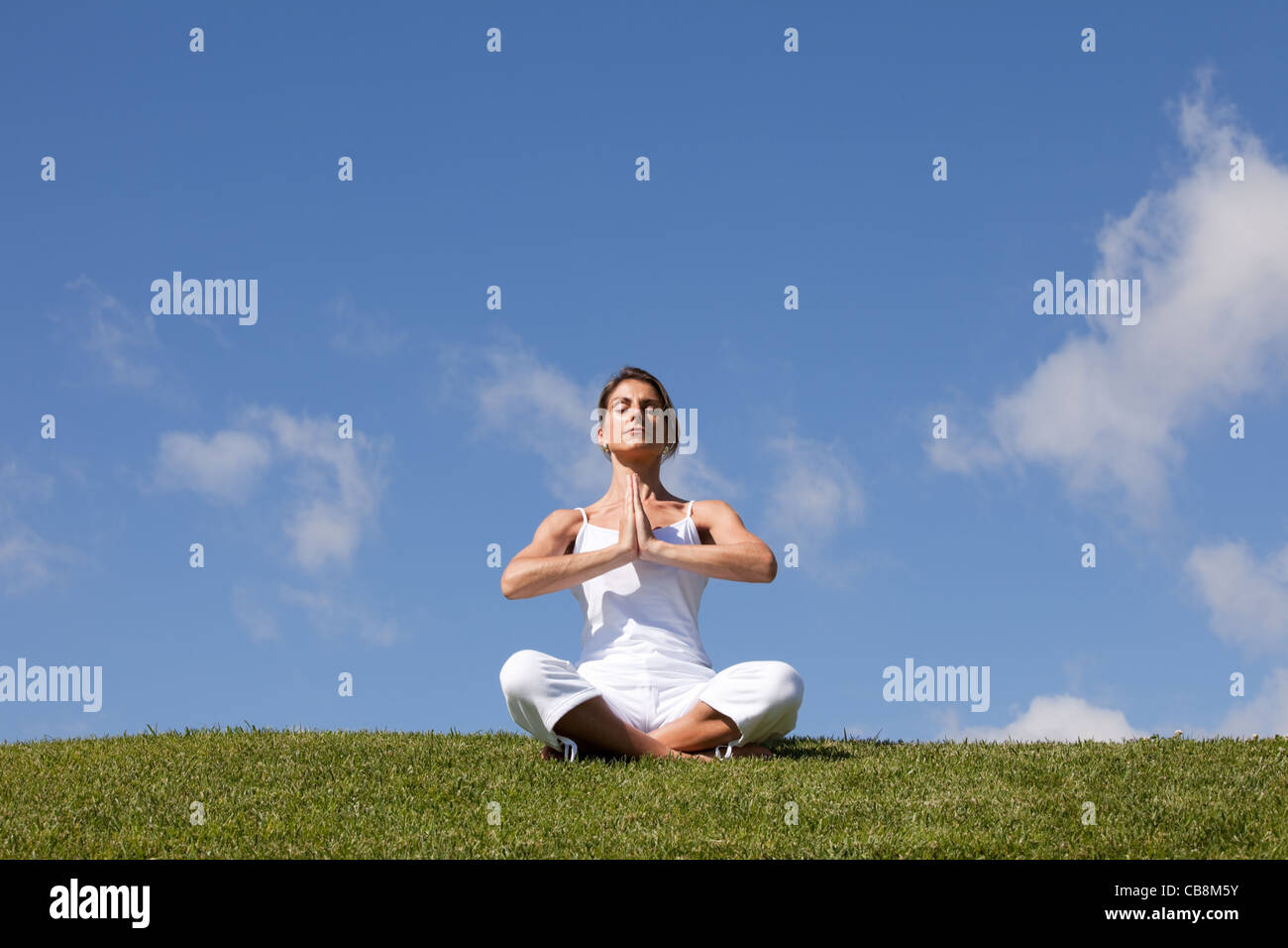 young woman enjoying nature in a yoga pose Stock Photo - Alamy