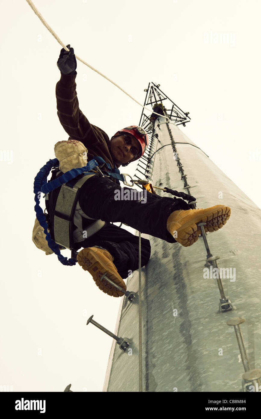 Cell Tower Climber on the way to the top of monopole Stock Photo Alamy