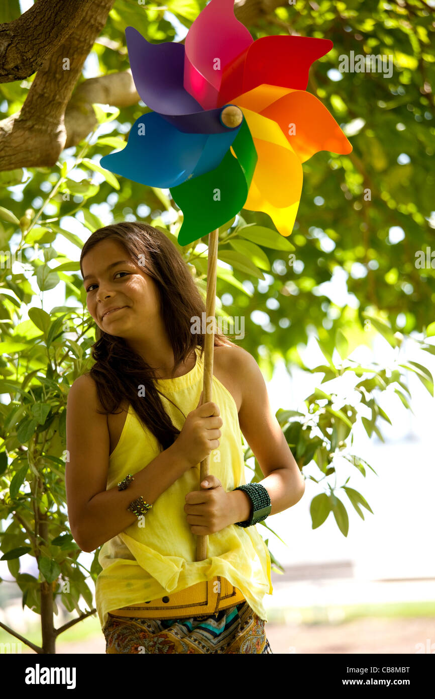 young woman child having fun at the park with her pinwheel Stock Photo ...