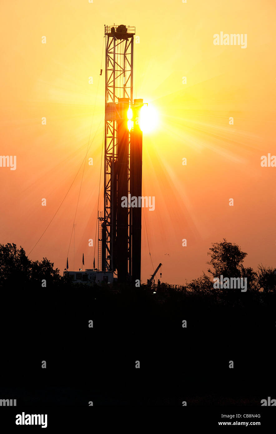 Drilling rig in Texas as sun rises, energy products is the major export of the United States. Photo taken in north Texas Stock Photo