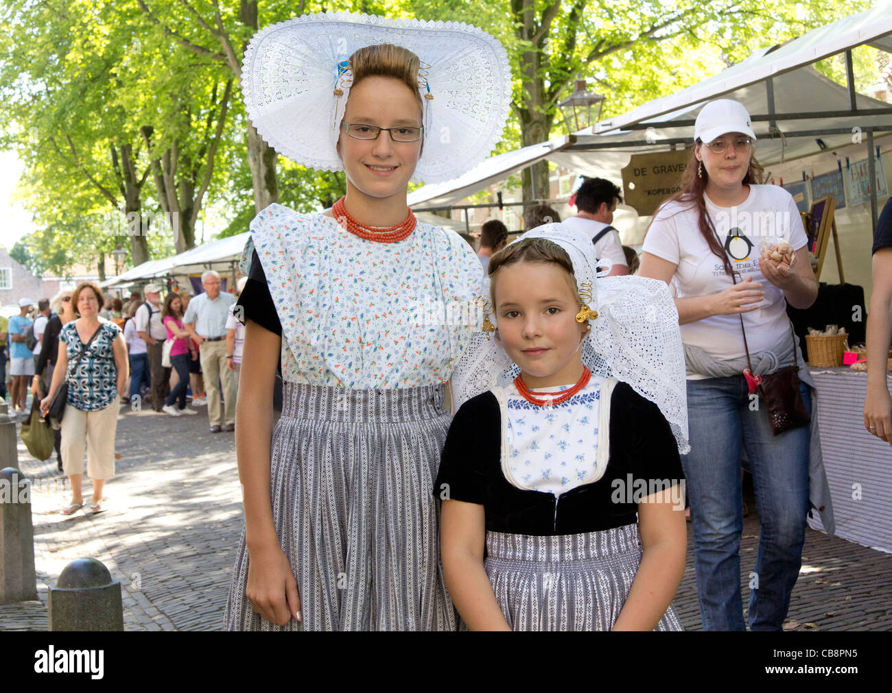 Photo of two girls in a traditional costume market in the town of Veere