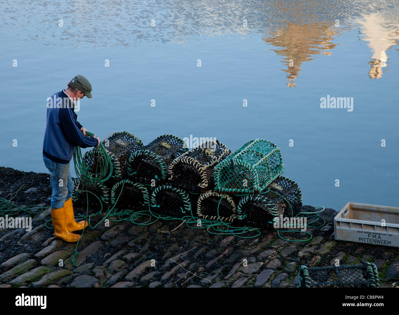 Fisherman preparing his lobster traps, Crail, East Neuk of Fife, Scotland Stock Photo