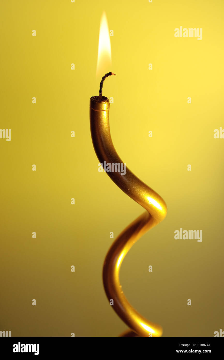 burning candle on colourful vivid background Stock Photo Alamy