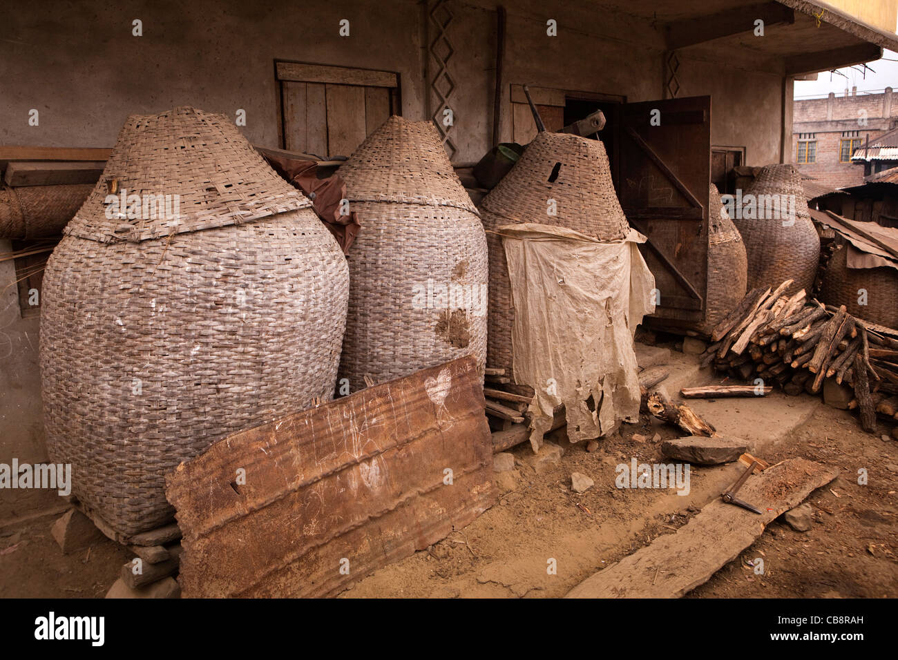 India, Nagaland, Jakhama Village, closely woven rat-proof rice storage ...