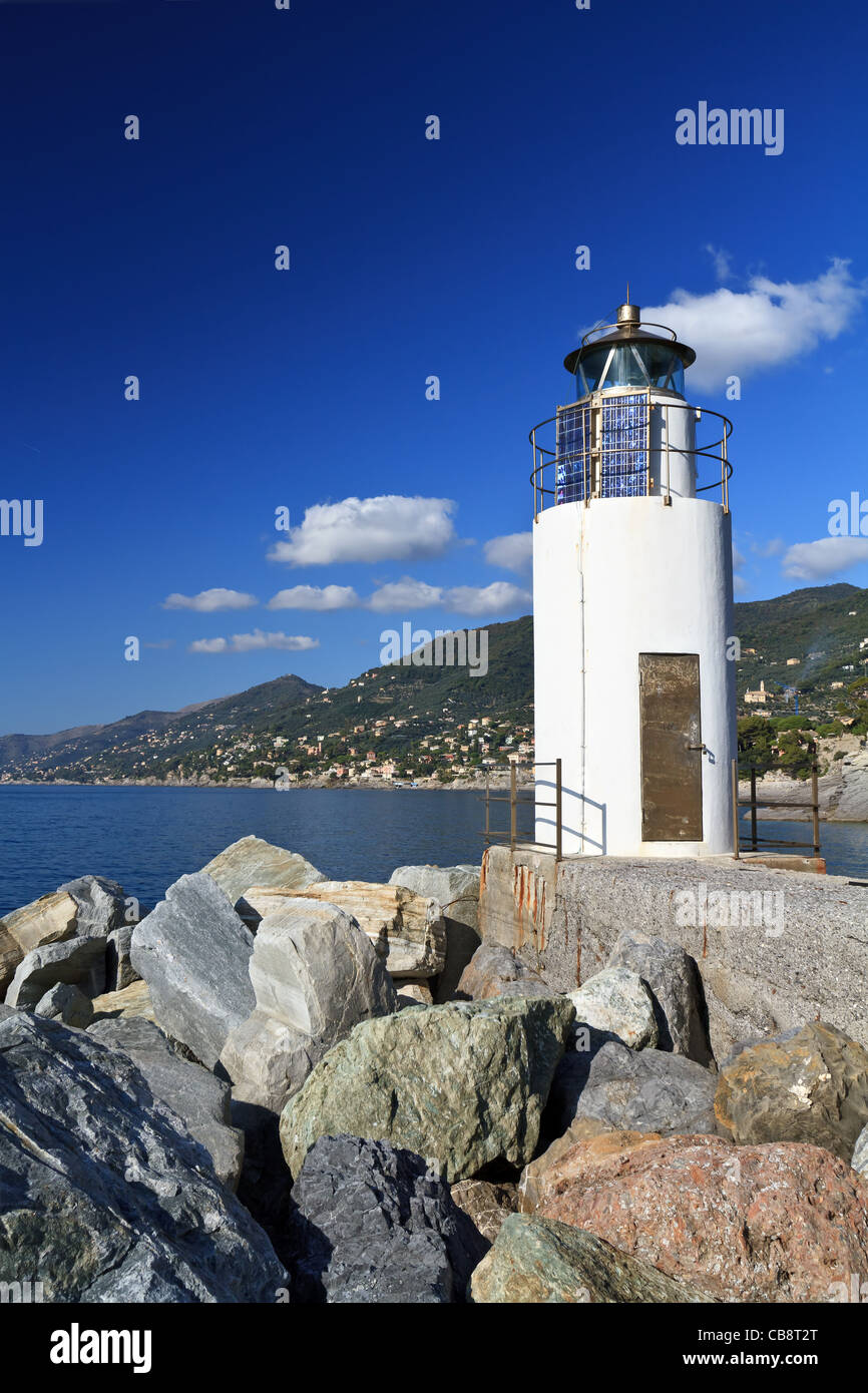 lighthouse over Mediterranean sea in Camogli, Italy Stock Photo