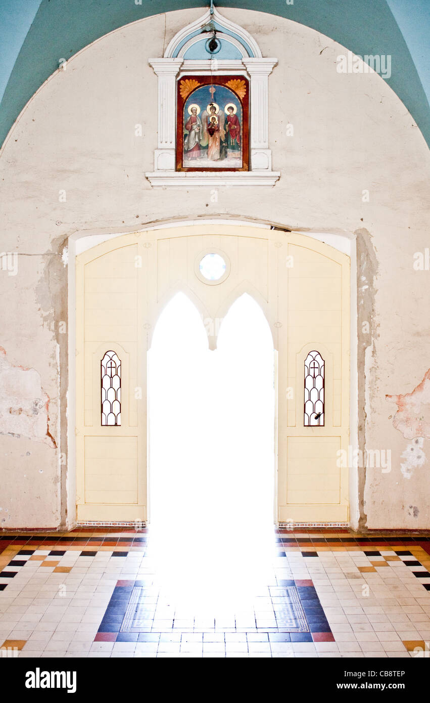 heavenly light coming out of church entrance door Stock Photo