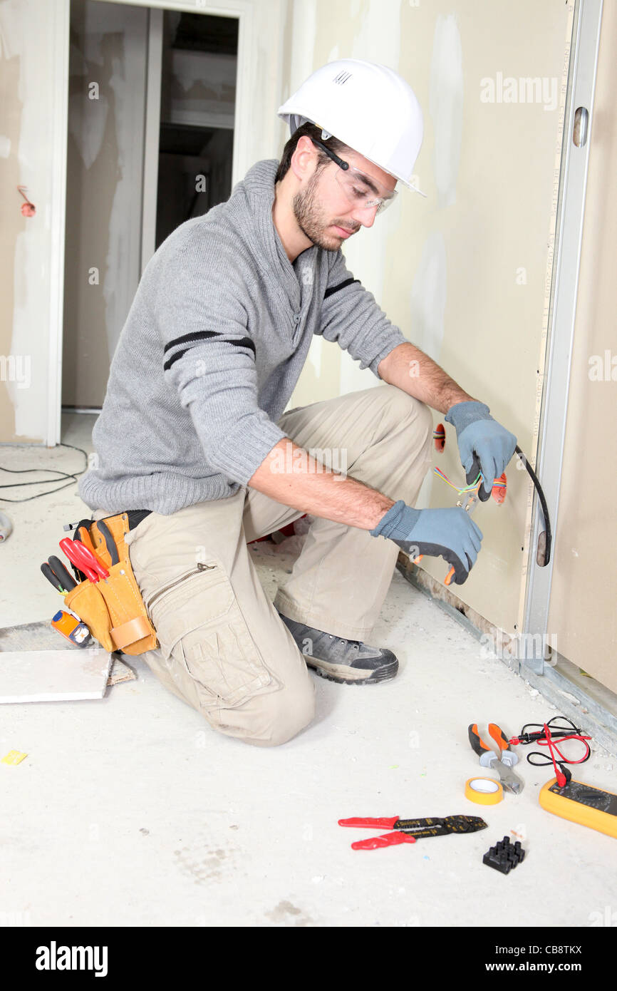 Electrician wiring a house Stock Photo - Alamy