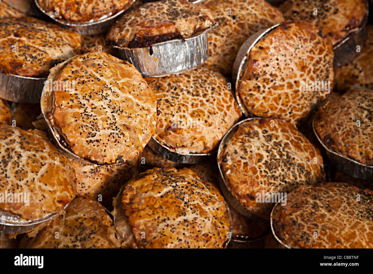 Meat pies on sale on market stall Wales UK Stock Photo