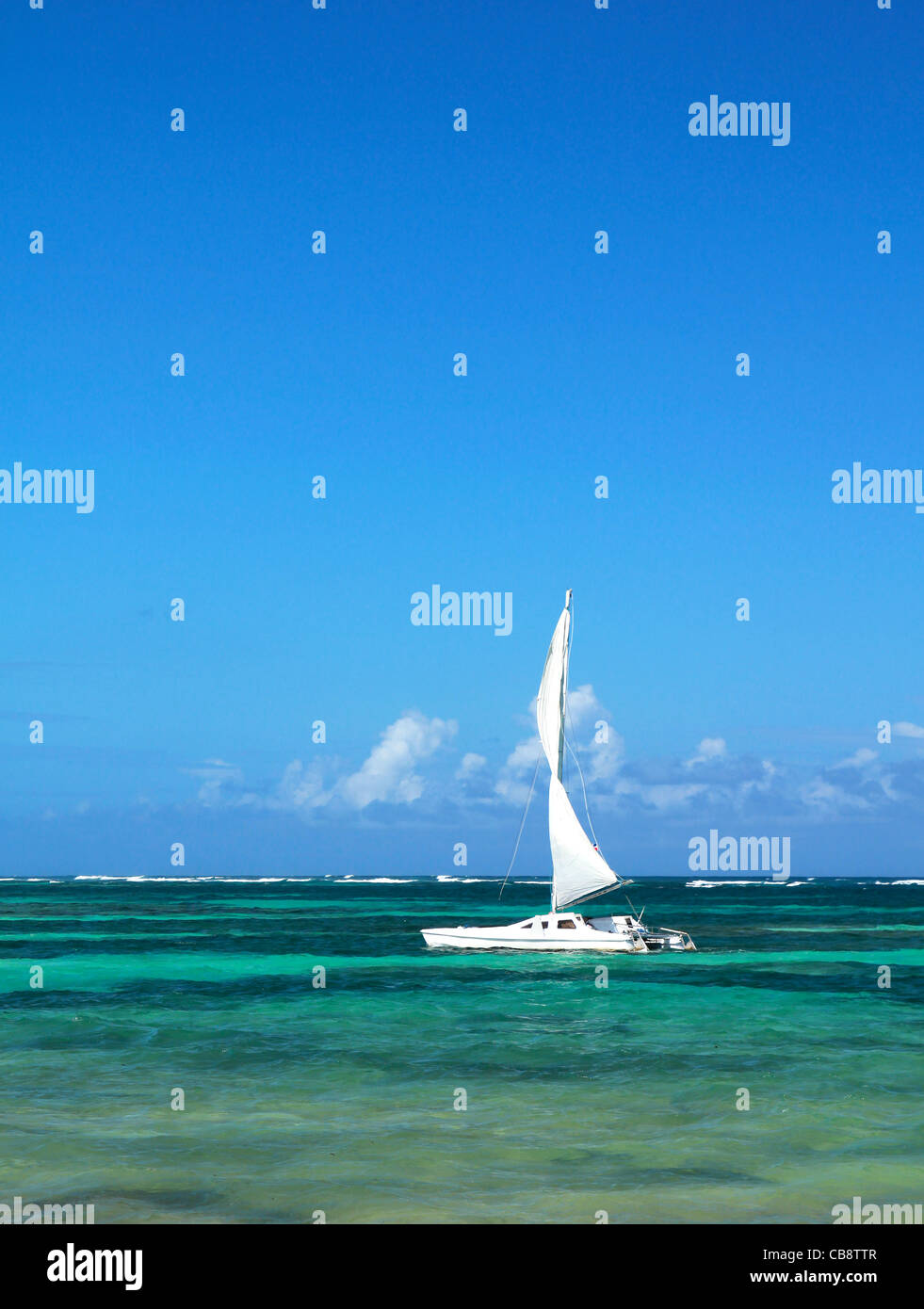 Yacht with sail in caribbean sea Stock Photo