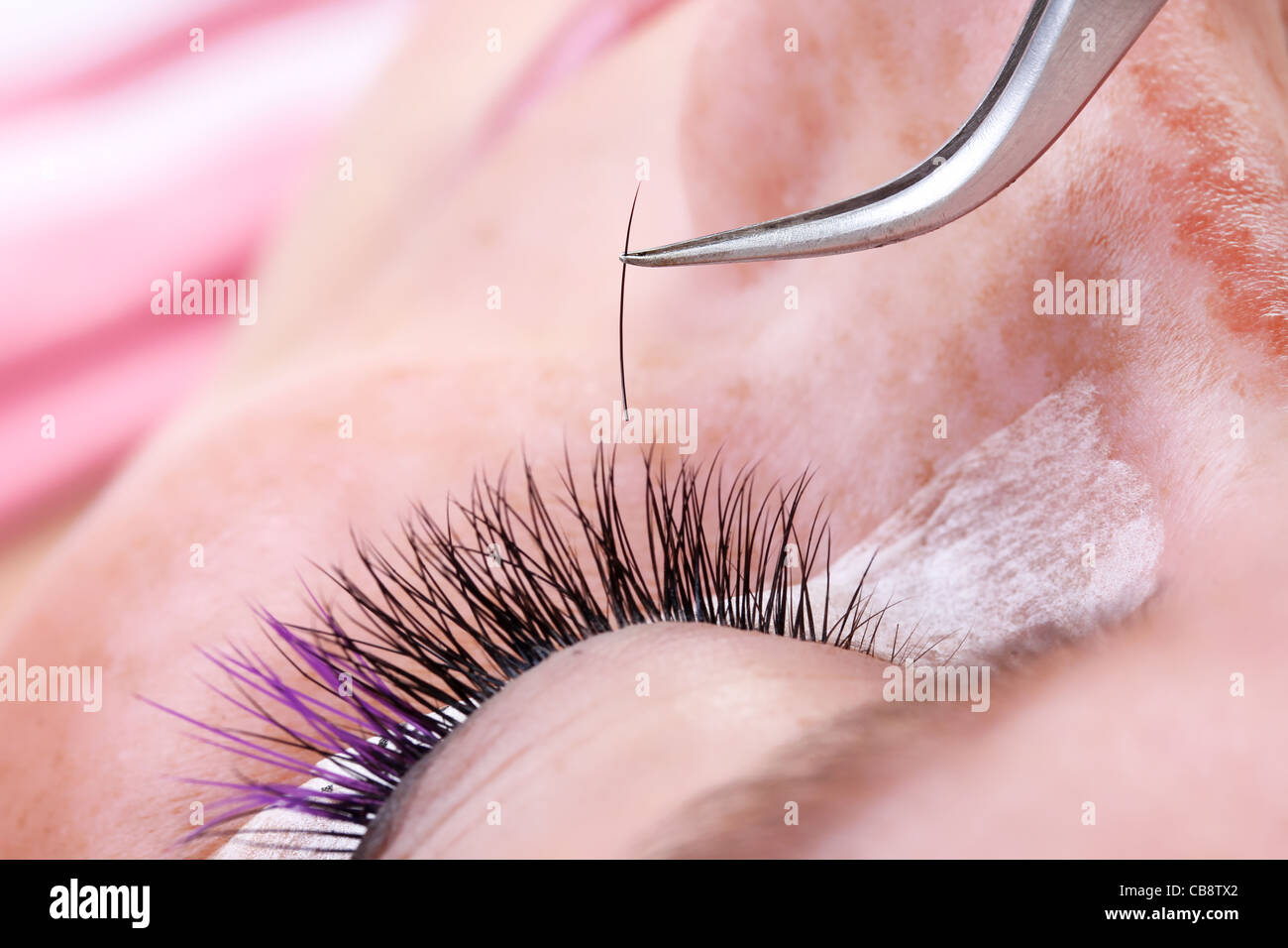 Lash making process, extreme long lashes and tweezers, close-up Stock Photo