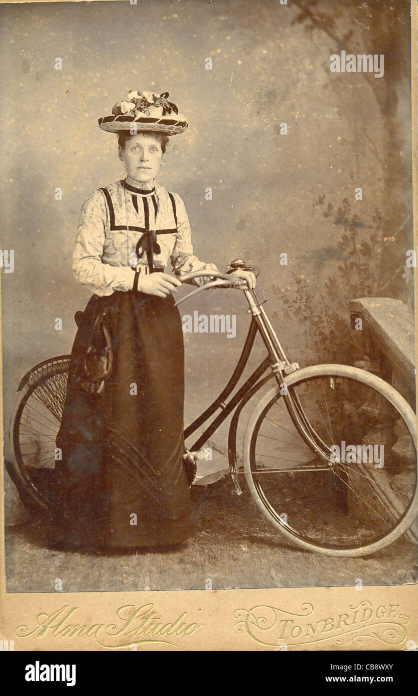 Cabinet photograph of woman with ladies bicycle 1890s Stock Photo