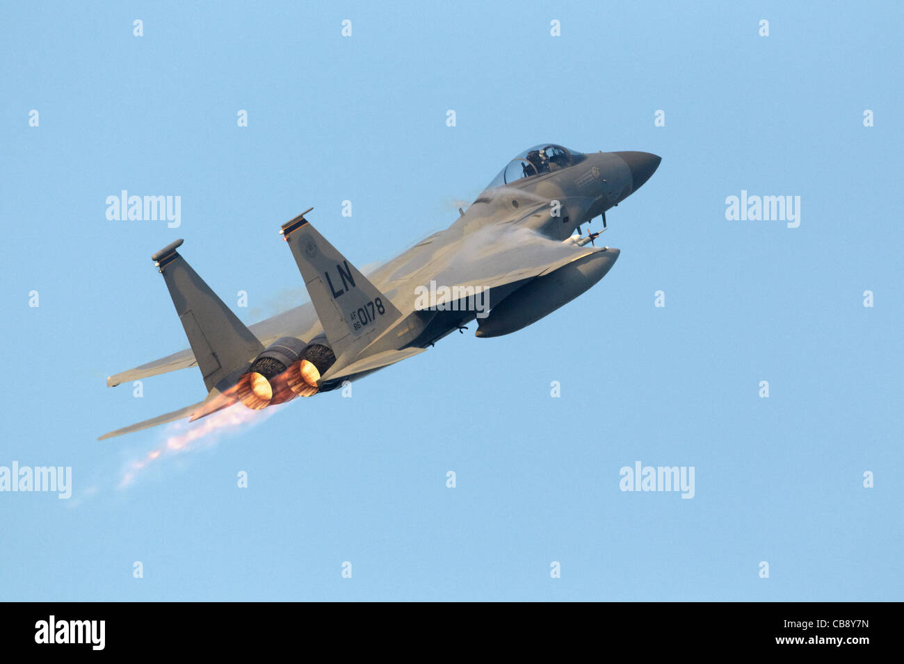 USAF McDonnall Douglas F15C Eagle climbing with afterburners on after taking off Stock Photo