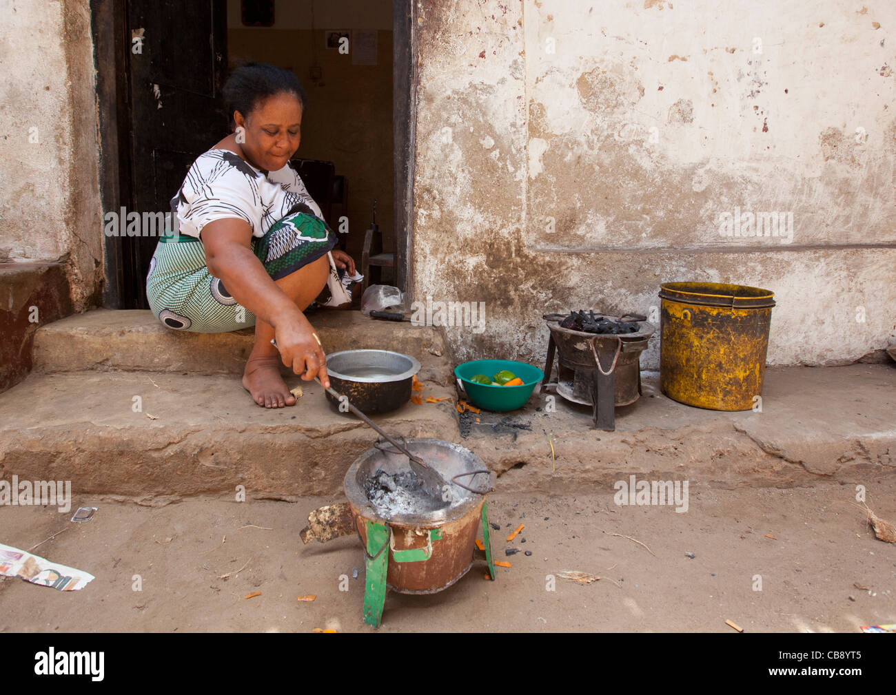 Woman Cooking In The Street, Lamu, Kenya Stock Photo