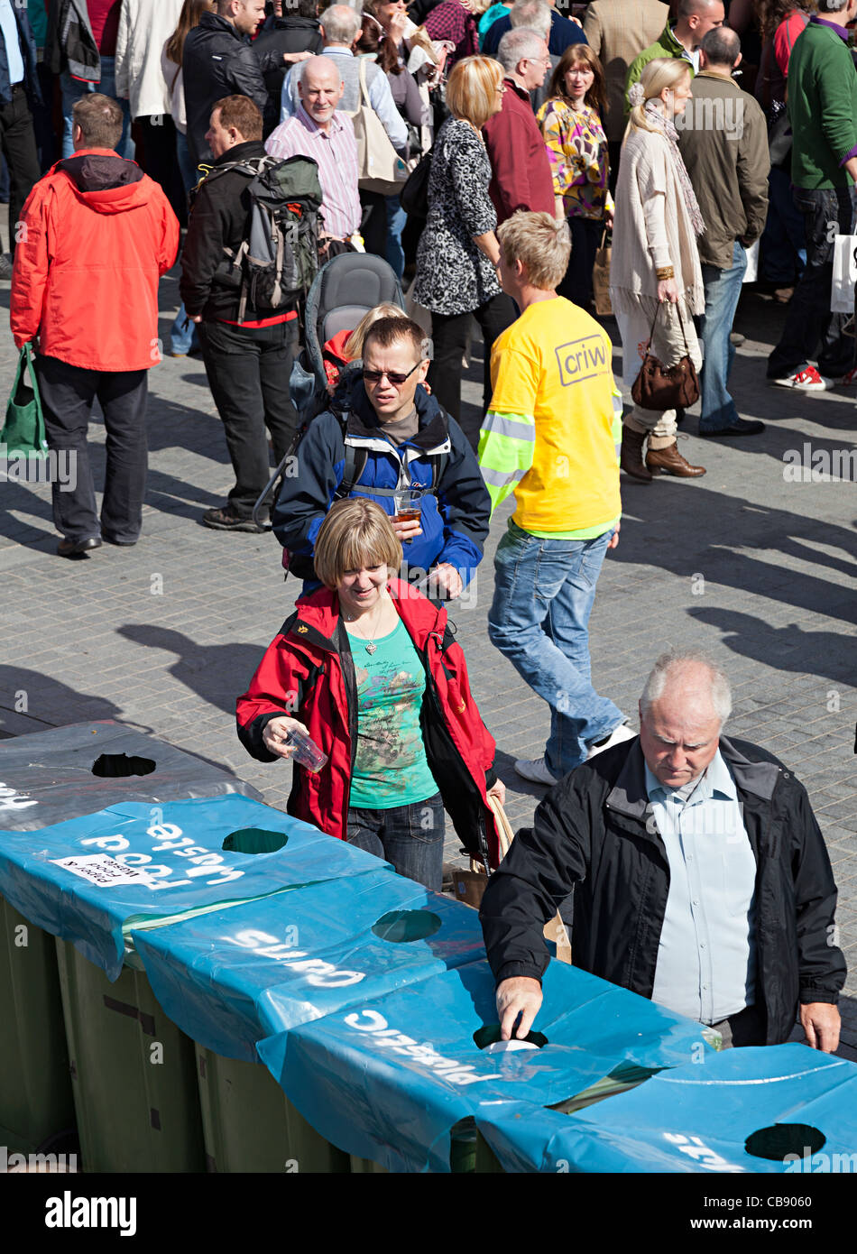 People disposing of rubbish in recycling bins Abergavenny Food Festival