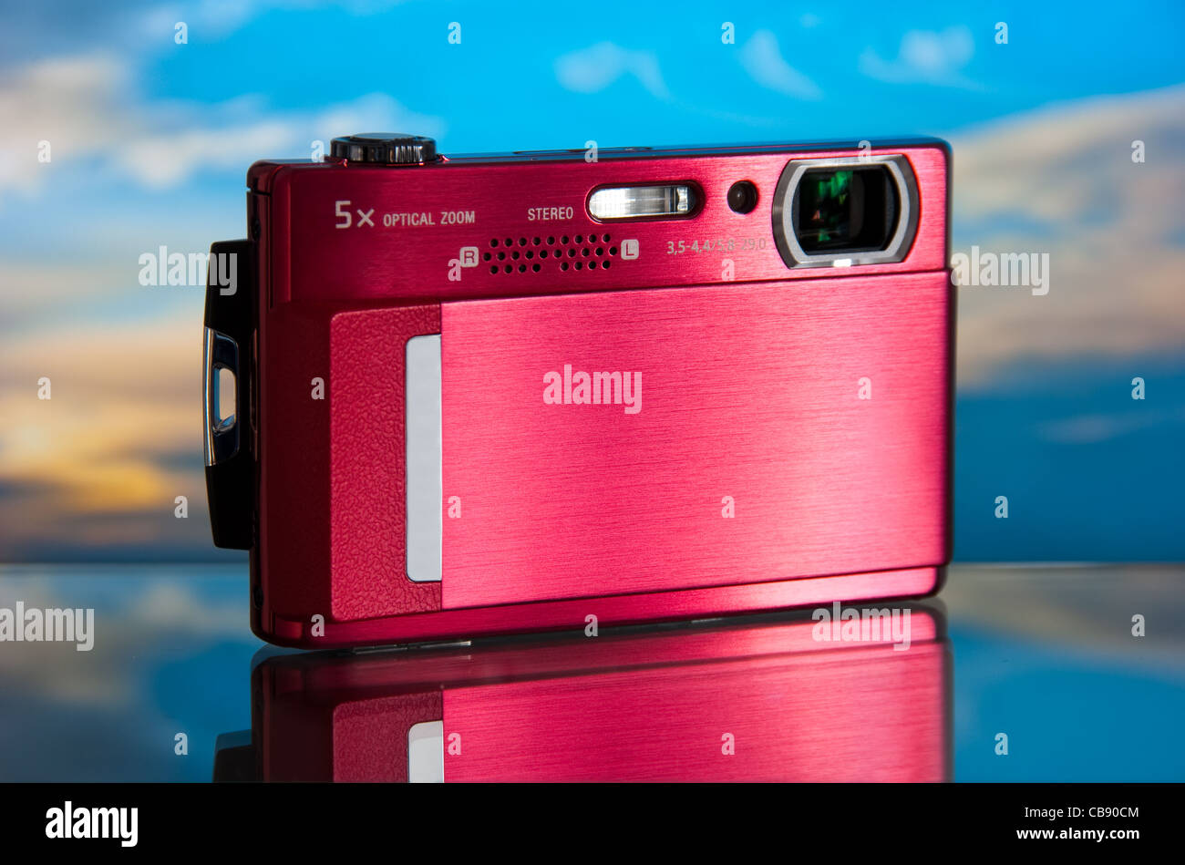 photo of the compact digital camera with beautiful background and glass reflection Stock Photo
