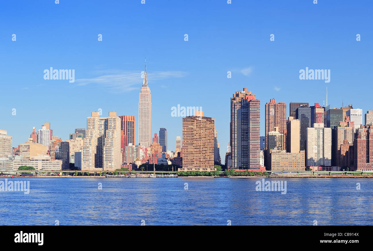 Manhattan midtown skyline panorama over East River with urban ...