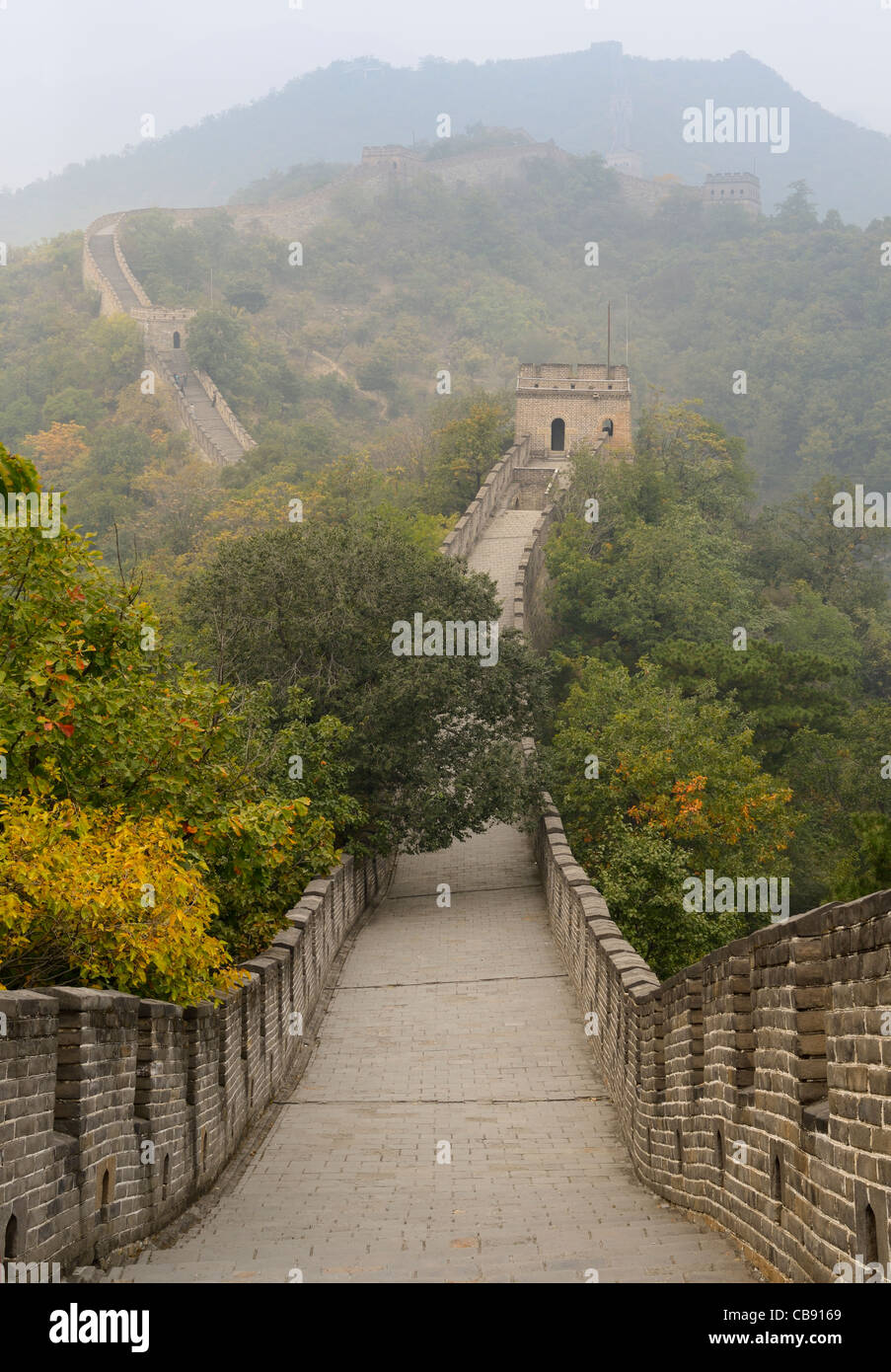 Evening view West towards tower 8 on the Great Wall of China in Fall at Mutianyu north of Beijing Peoples Republic of China Stock Photo