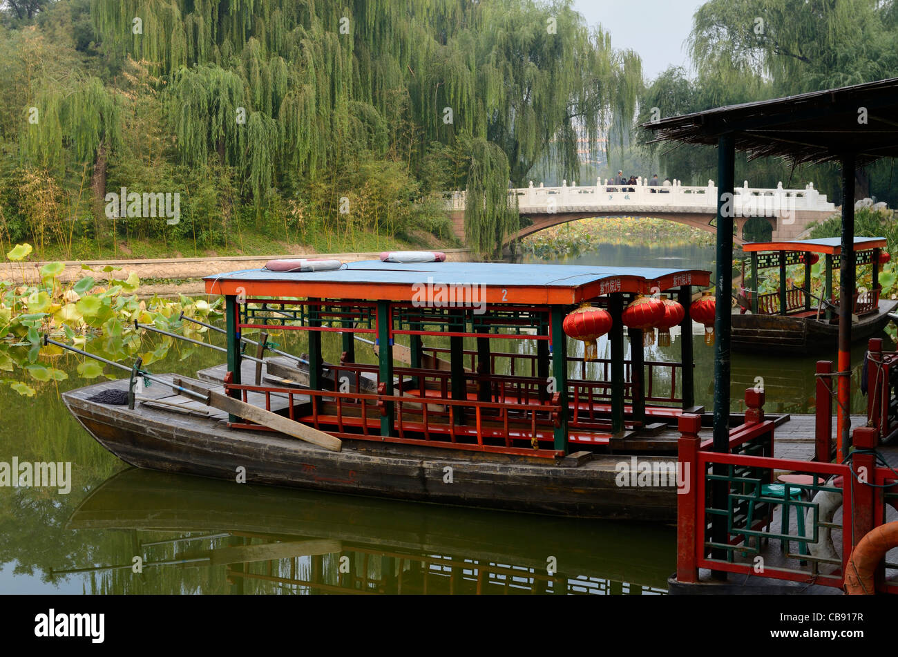 River boats moored at Peng Bridge Zizhuyuan Purple Bamboo Park Beijing Peoples Republic of China Stock Photo