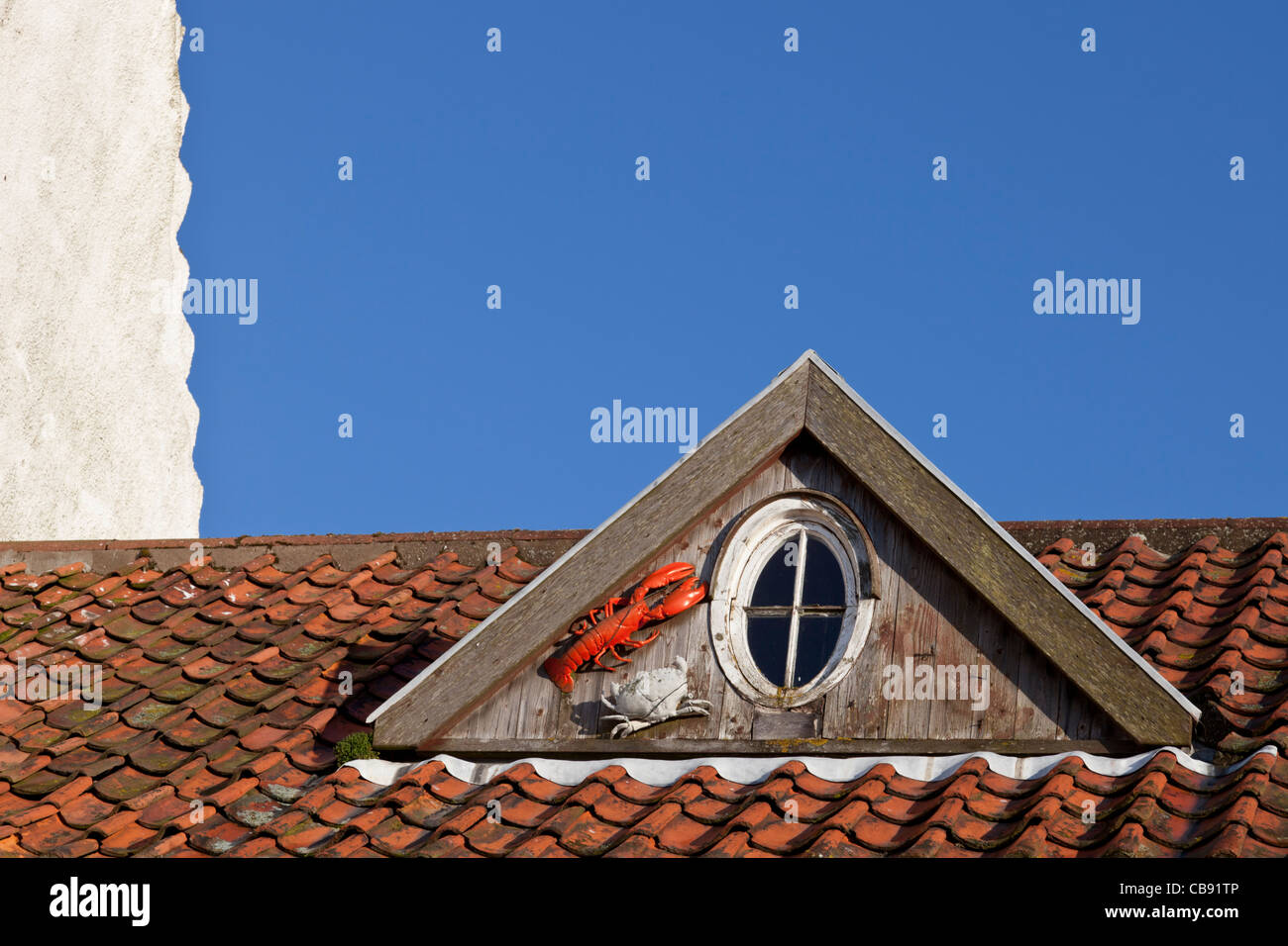 Lobster and crab on roof dormer window, Crail, East Neuk of Fife, Scotland Stock Photo