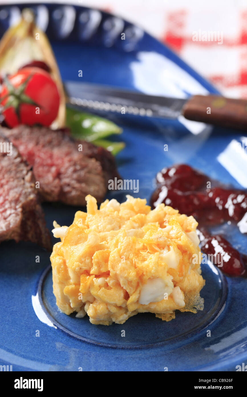 Scrambled eggs as side dish to roast beef Stock Photo Alamy