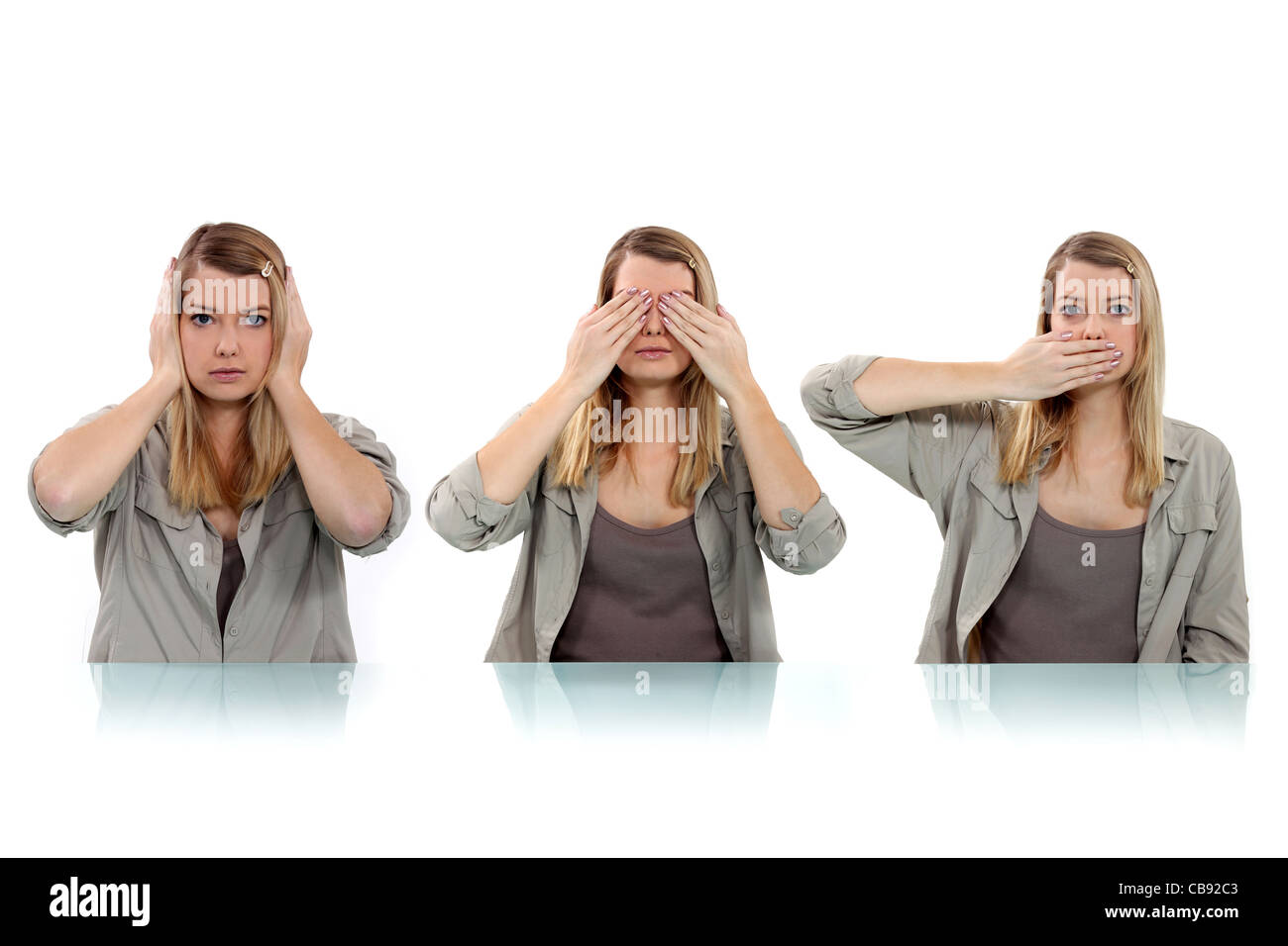 woman covering her eyes, ears and mouth with her hands Stock Photo Alamy