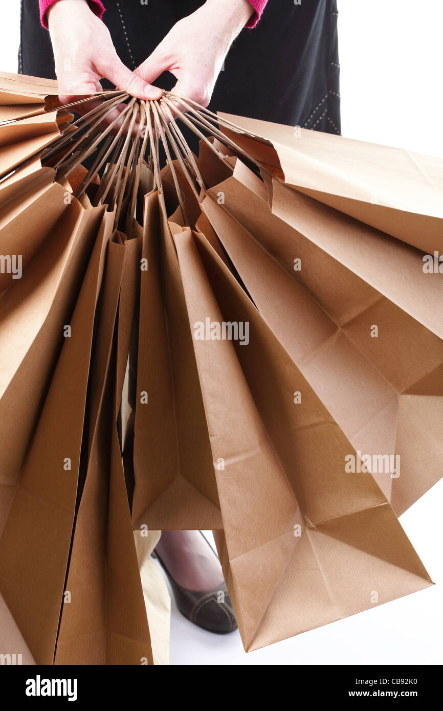 Shopping brown recycle gift bags in woman hand Stock Photo Alamy