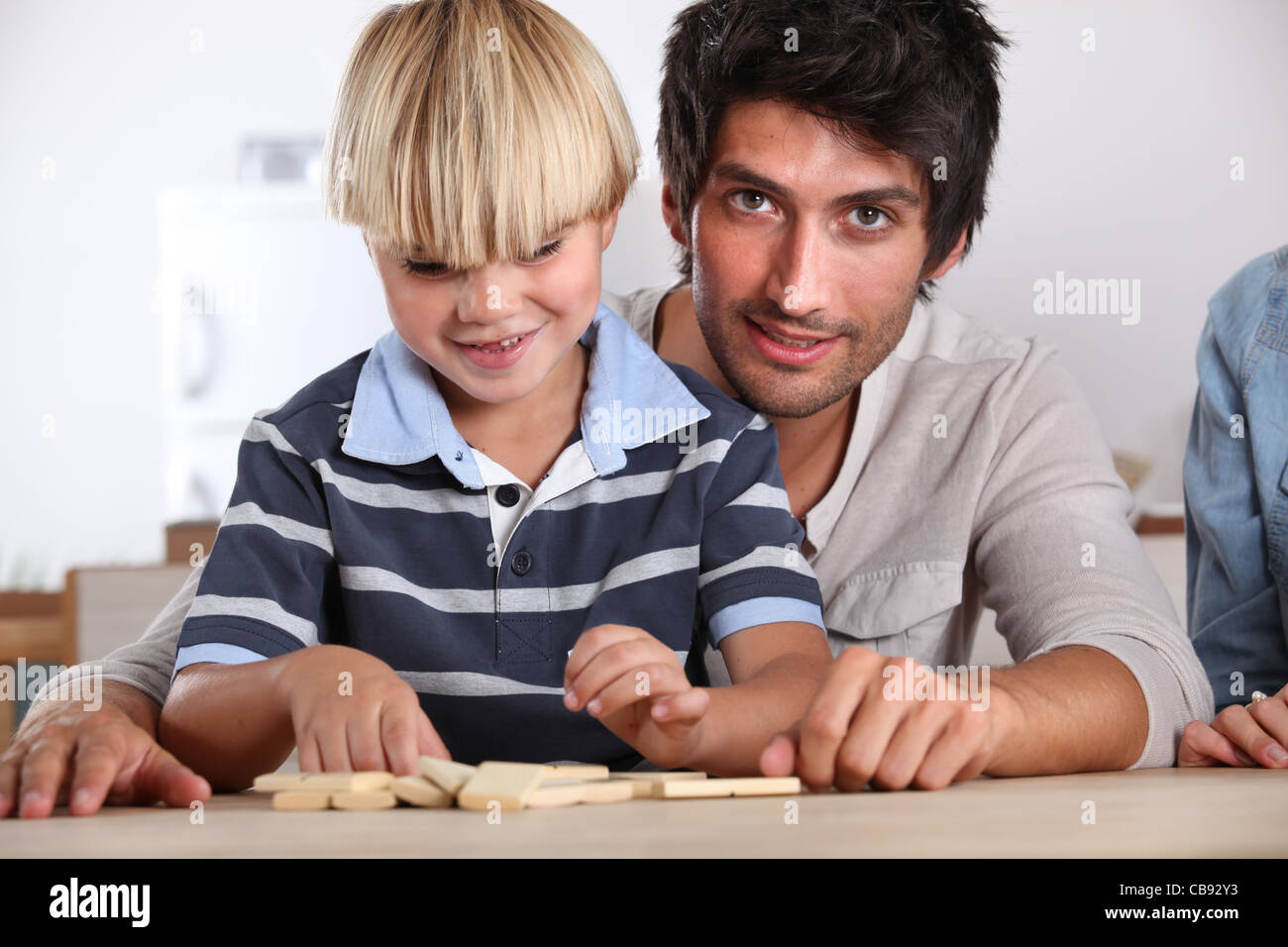 Learning how to play dominos Stock Photo Alamy