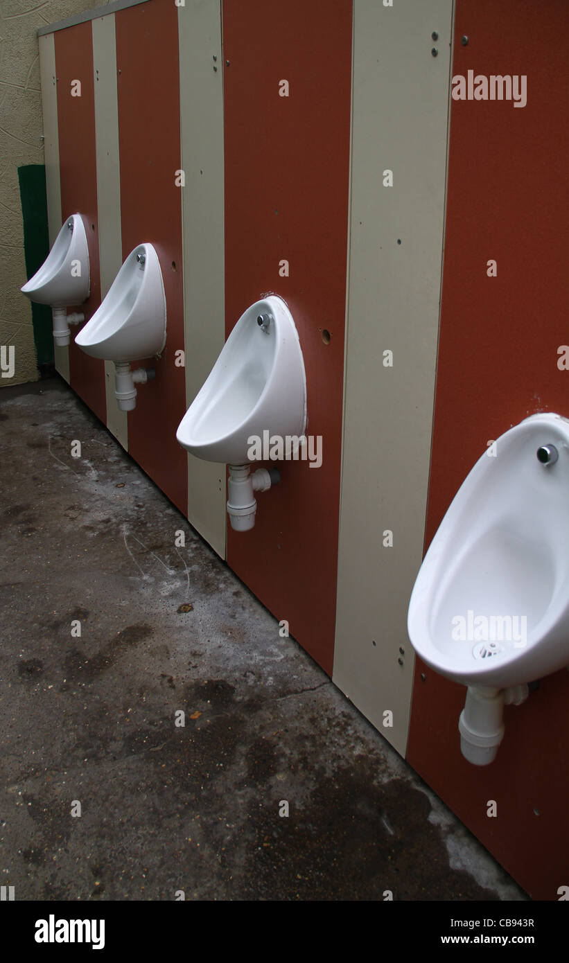 Basic mens urinals at outdoor park. Stock Photo