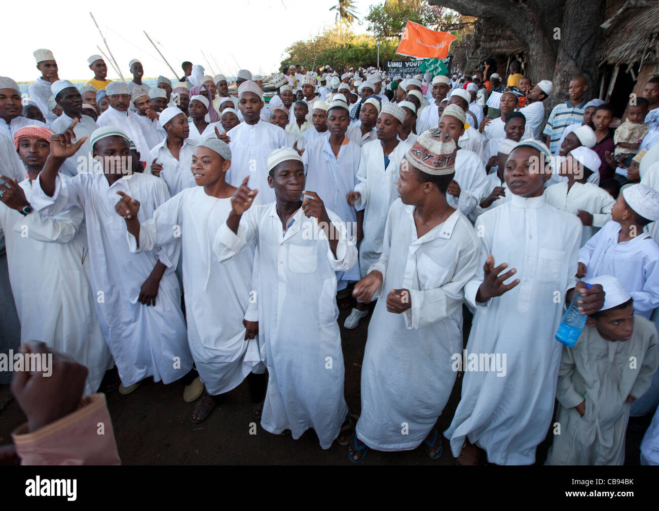 Men And Teenage Boys With Traditional Dressing Singing And Dancing At Maulidi Festival Lamu, Kenya Stock Photo