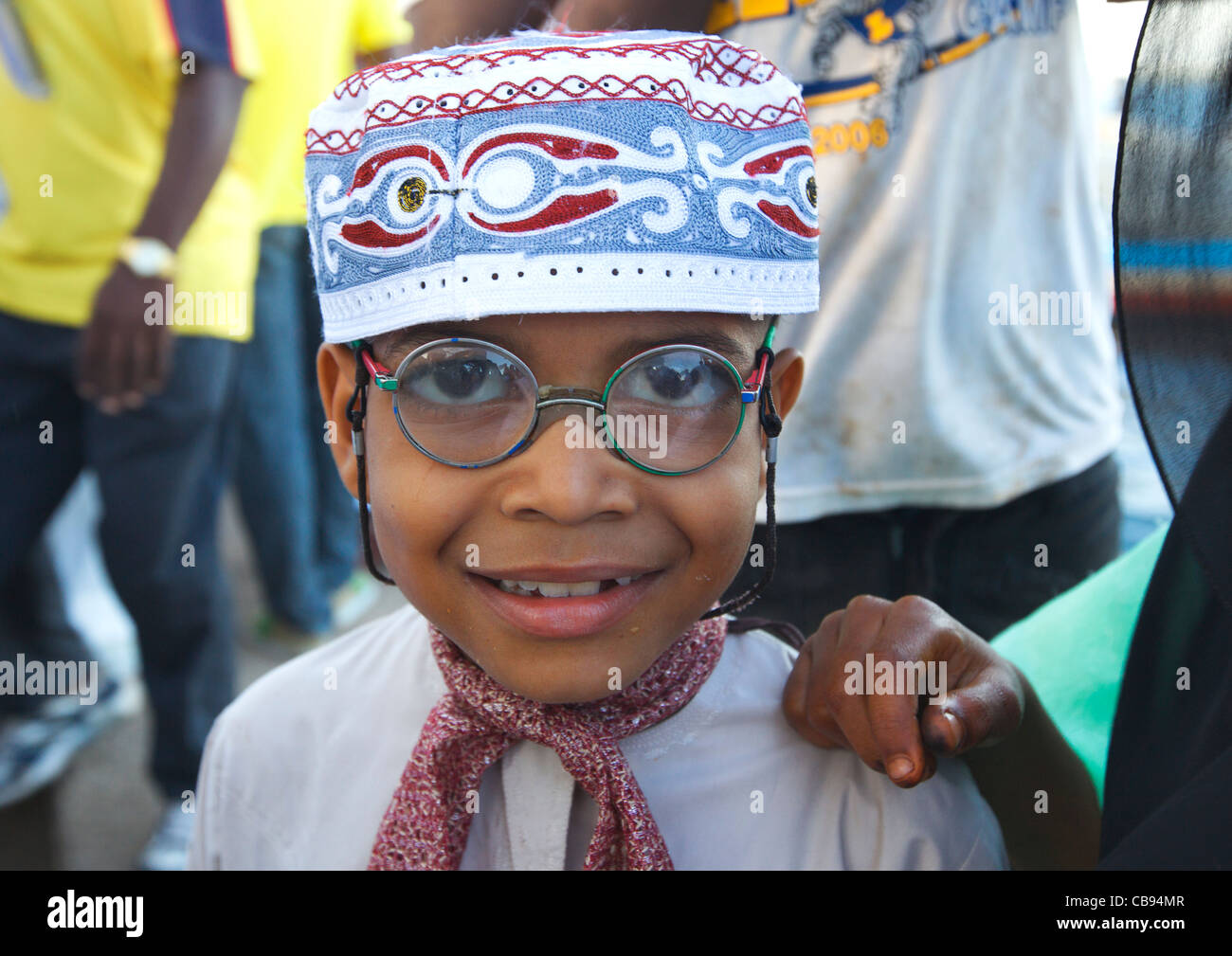 Young Boy Wearing Kofia Hat And Glasses At Maulidi Festival, Lamu, Kenya Stock Photo