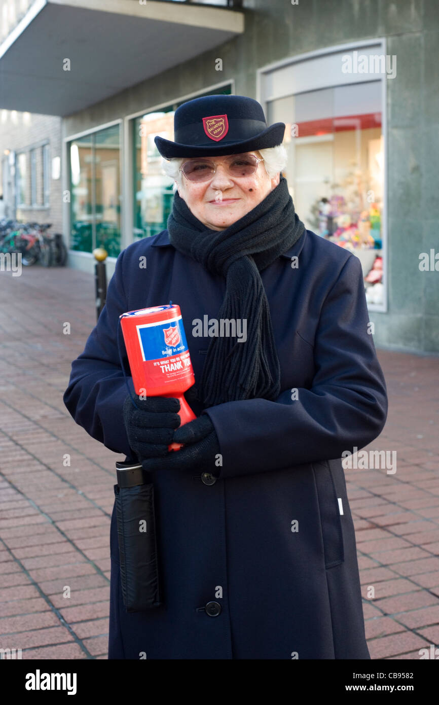 elderly lady collecting for the salvation army in the run up to christmas Stock Photo